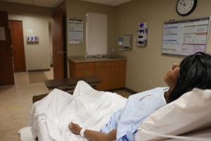 medical training mannequin in hospital bed